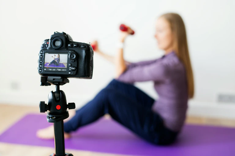 A person working out while a camera films them