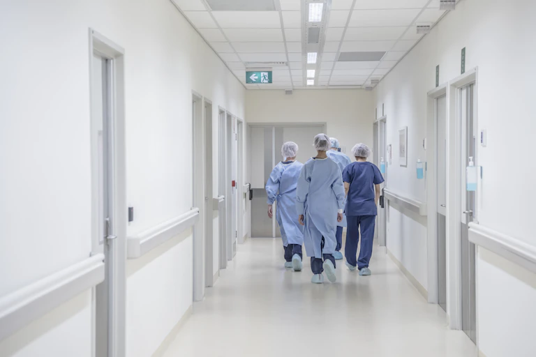 Doctors walking down a hospital corridor