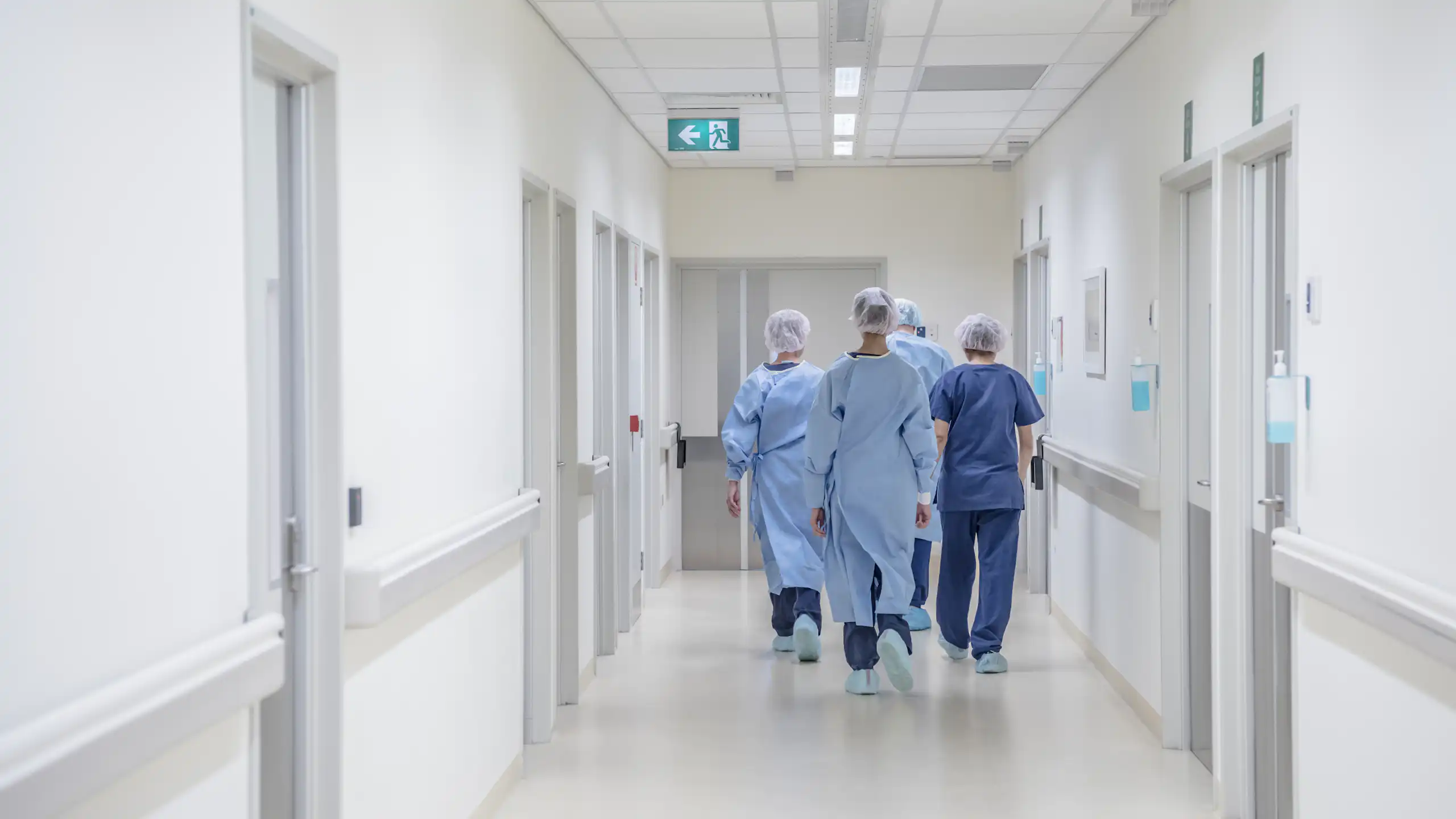 Doctors walking down a hospital corridor