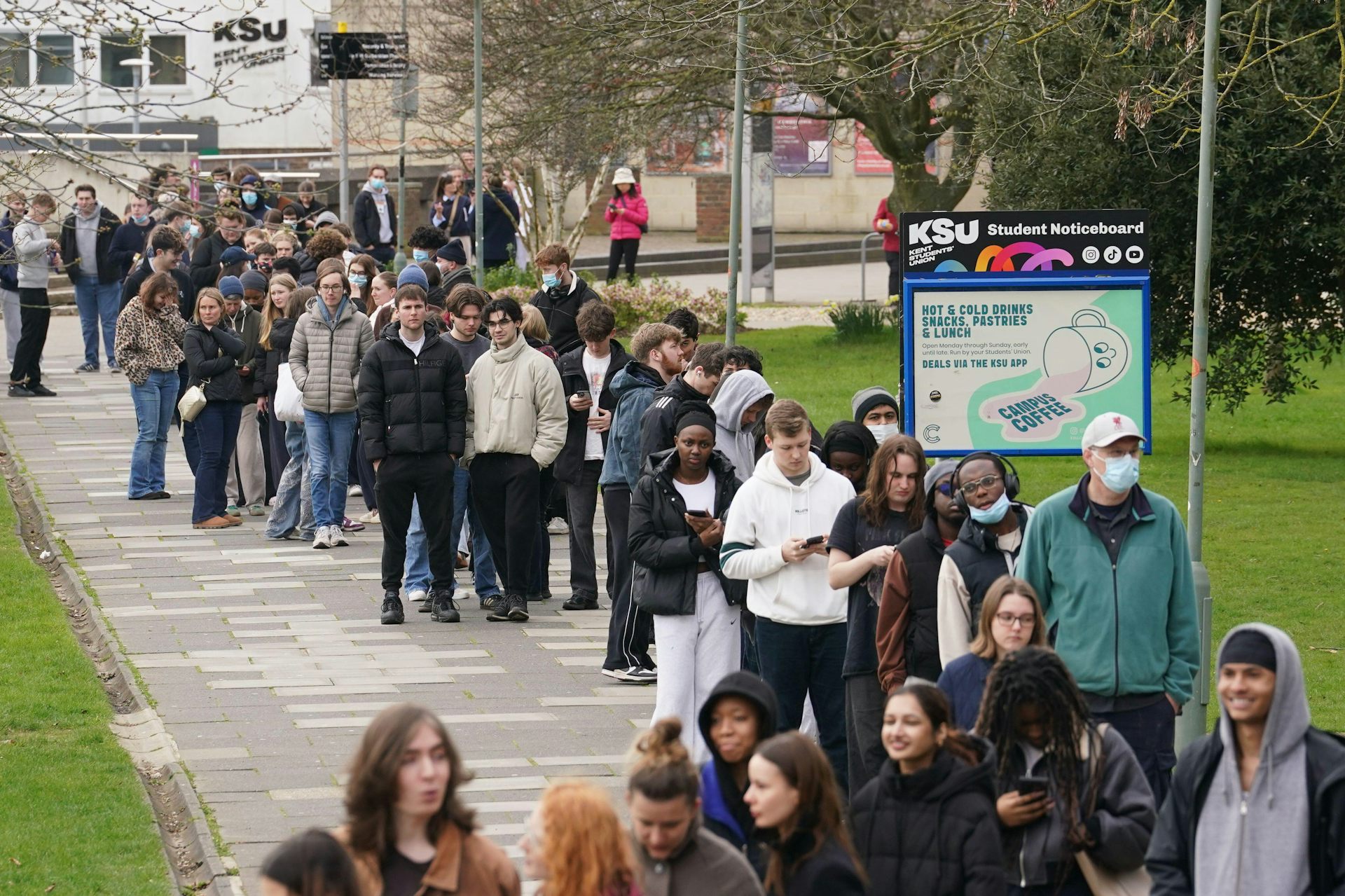 Students queuing for antibiotics outside a building at the University of Kent in Canterbury.