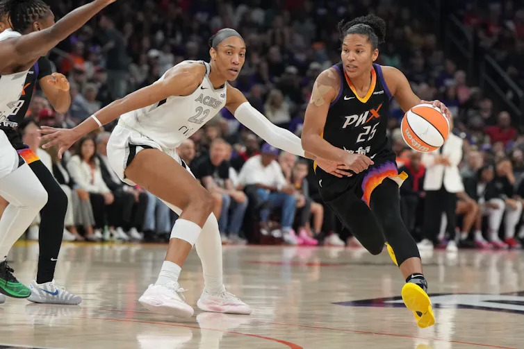 Women playing basketball