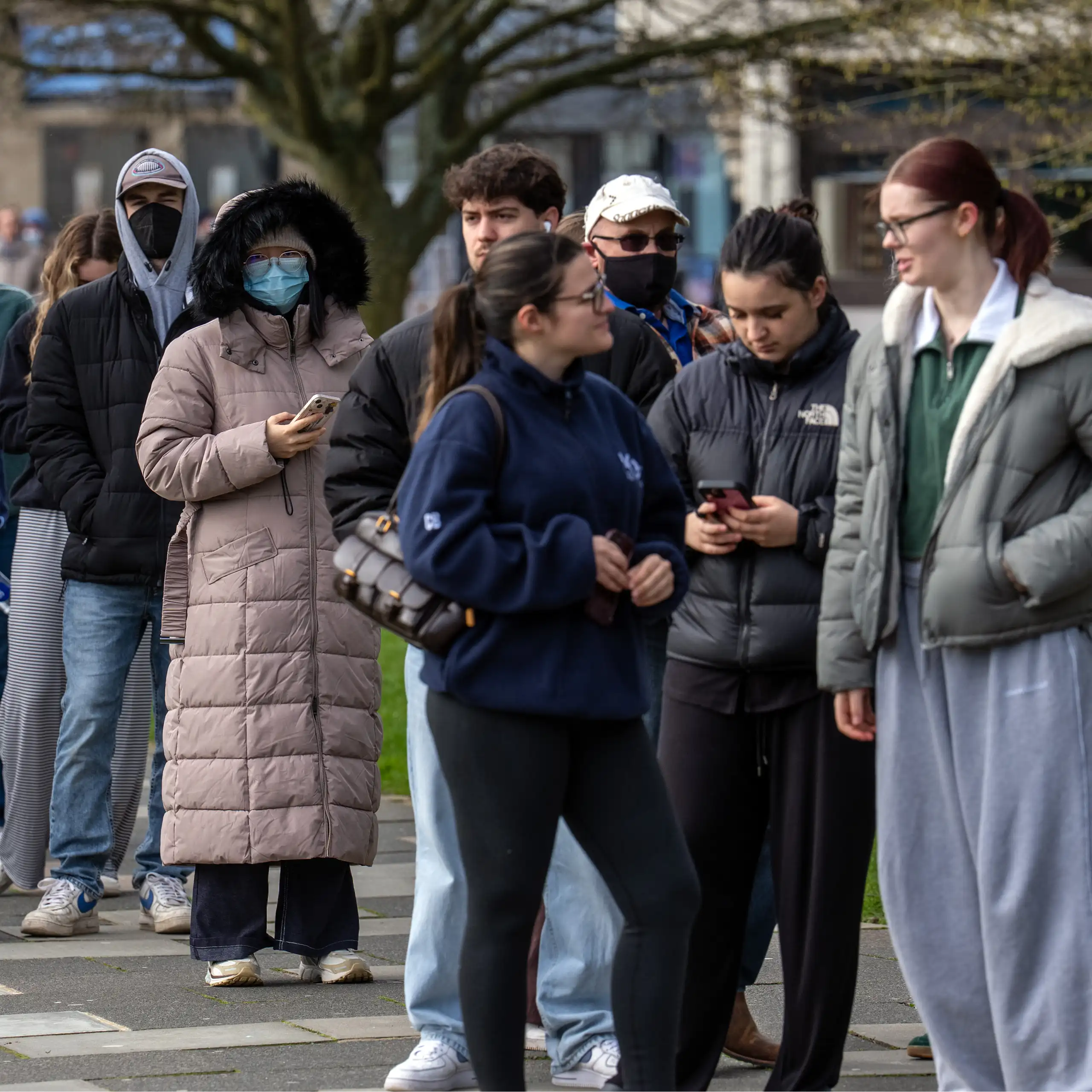 Staff and students queue to receive antibiotics at the University of Kent, UK, after two people died in an outbreak of bacterial meningitis