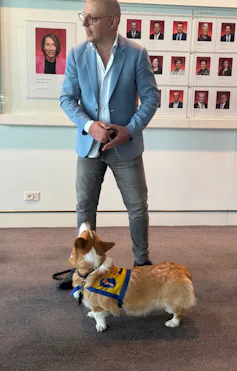 Lead author, Giuseppe Carabetta, with his assistance dog Monty, on a visit to Parliament House.