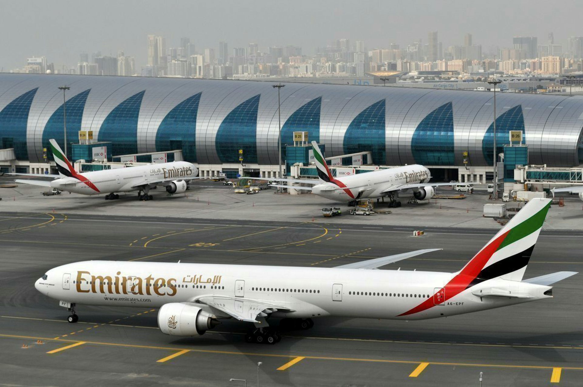 Emirates plane taxis to a gate at Dubai International Airport in Dubai