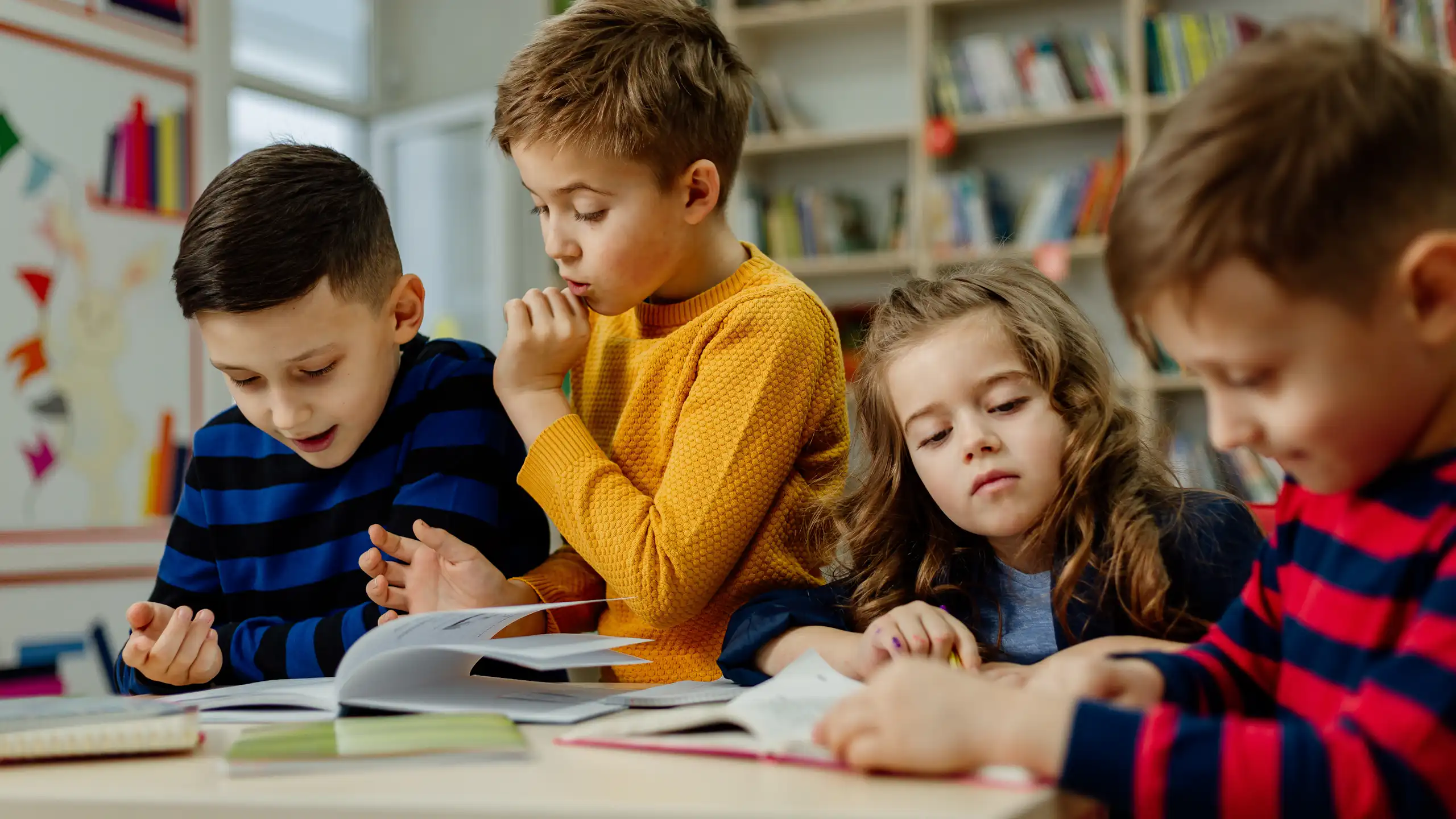 Children looking at books together
