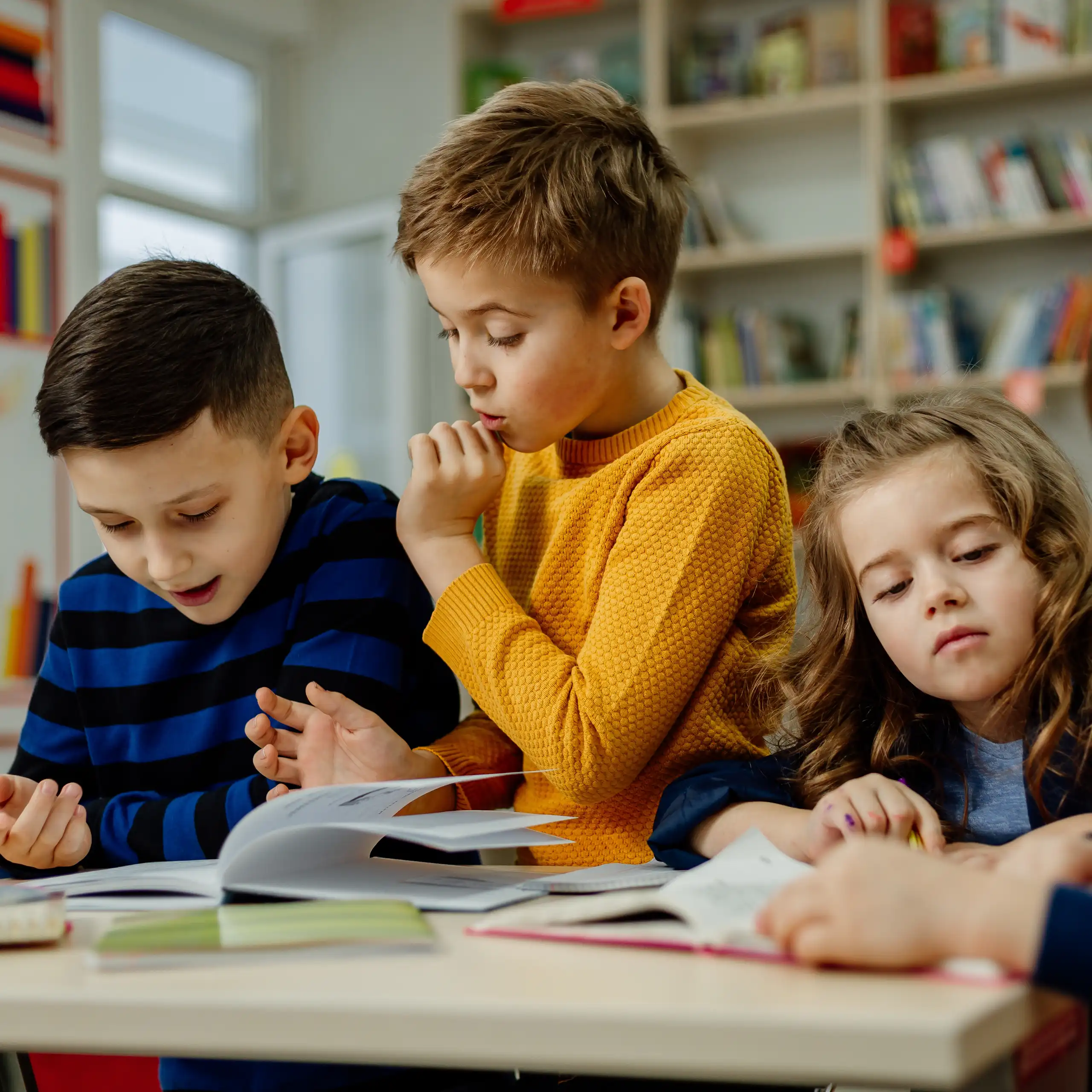 Children looking at books together