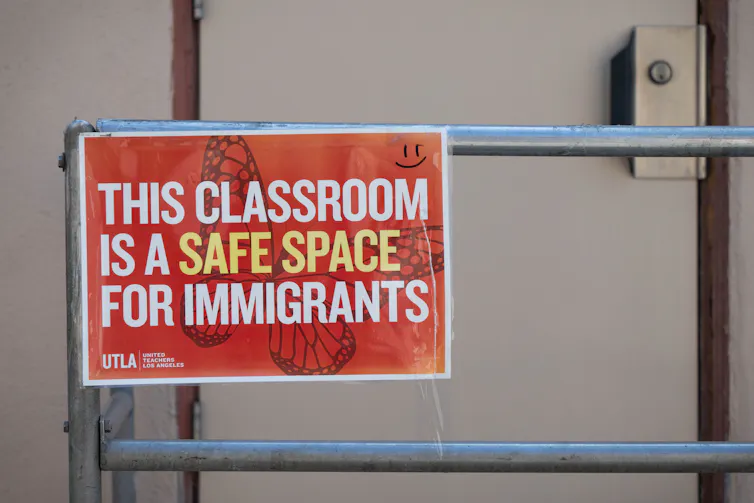 Immigrant youngsters can attend college irrespective of citizenship – some states are difficult this usual 1 A red sign on a metal pole says, 'This classroom is a safe space for immigrants.'
