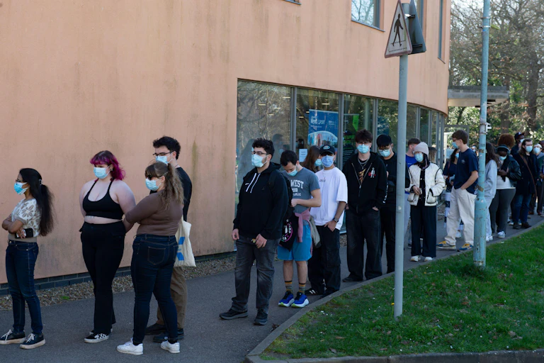 Student queueing to get the MenB vaccine in Canterbury, England.
