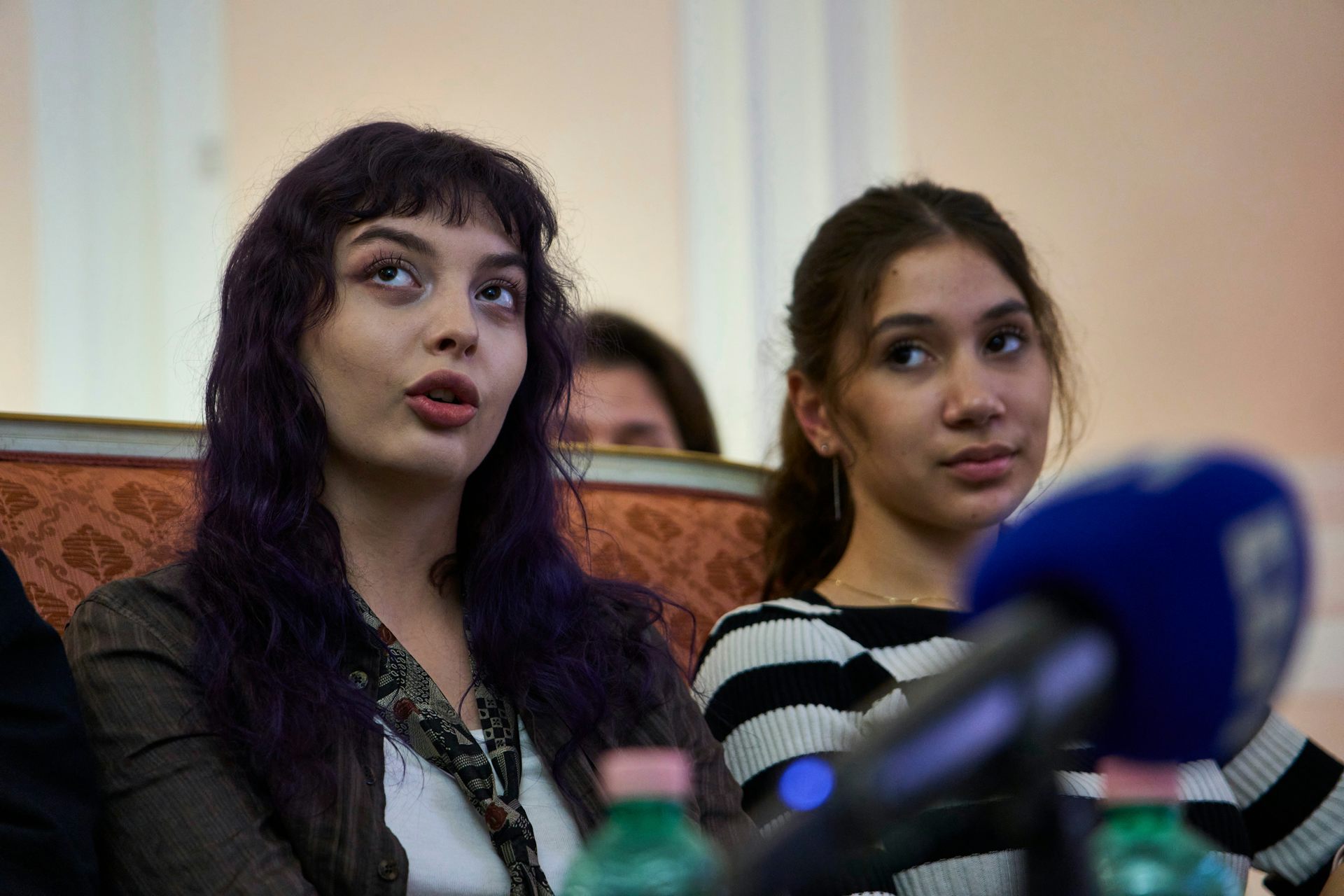 Two teenaged girls with dark hair.