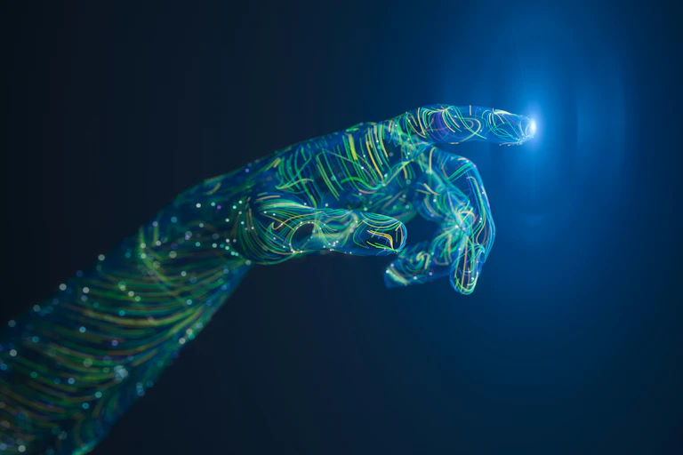 computer wiring in the form of a human hand reaching out against a dark background