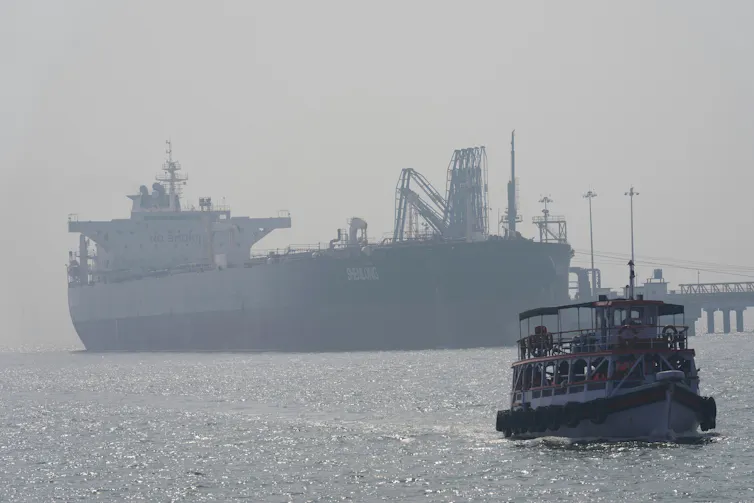 A large oil tanker arriving at a port.