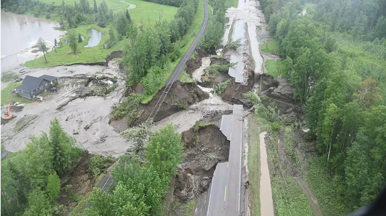a road damaged by flooding