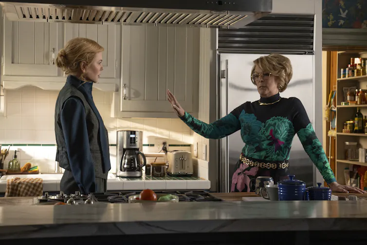 two women in a glossy kitchen