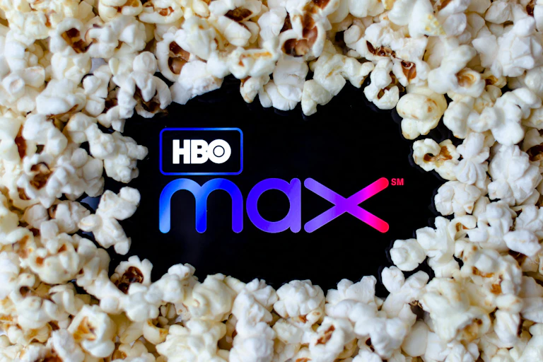 The logo for HBO Max surrounded by popcorn