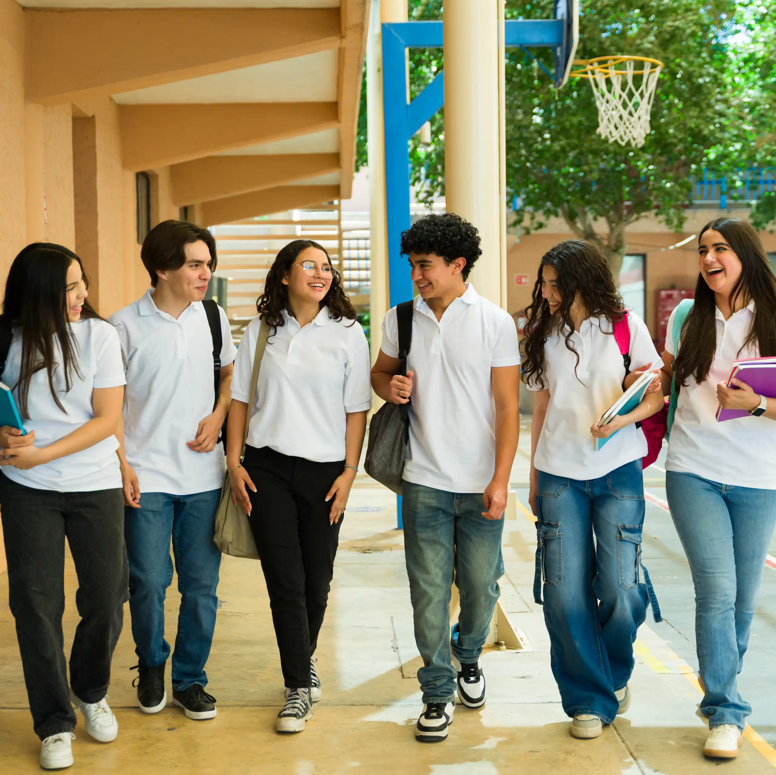 Teenagers at school walking and laughing