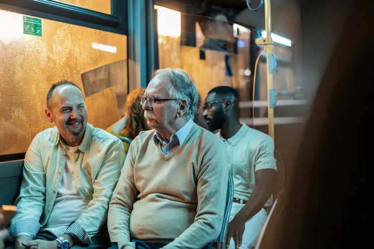 People chatting on a bus