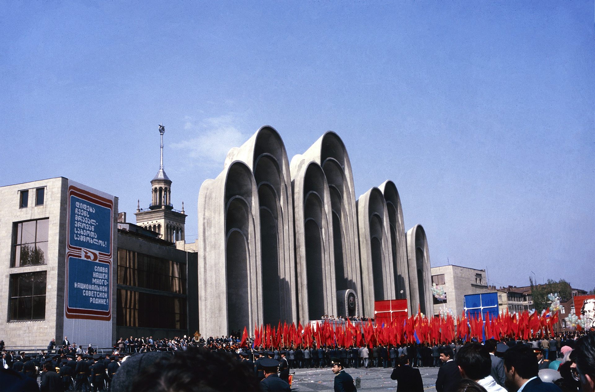 An archival photograph of a parade in Georgian Soviet times.