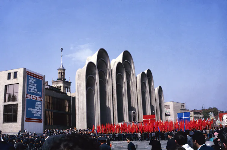 An archival photograph of a parade in Georgian Soviet times.