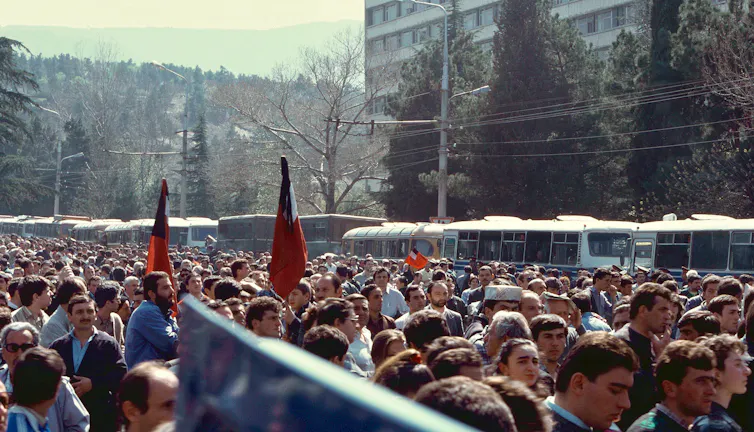 Protestors in a street in the 1990s.