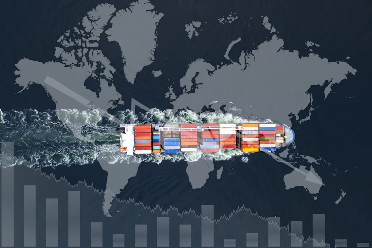 Aerial view of a container ship superimposed over a grey world map