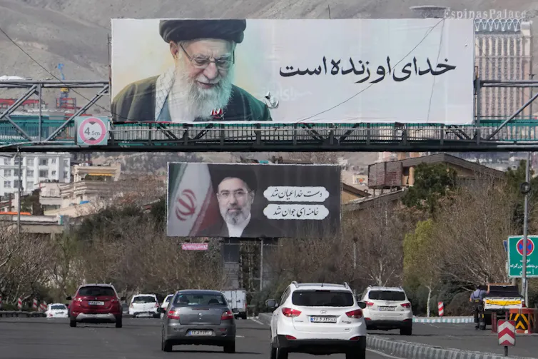 A freeway in Tehran with pictures of the assassinated supreme leader Ali Khanenei and his son, the new supreme leader, Mojtaba Khamenei.