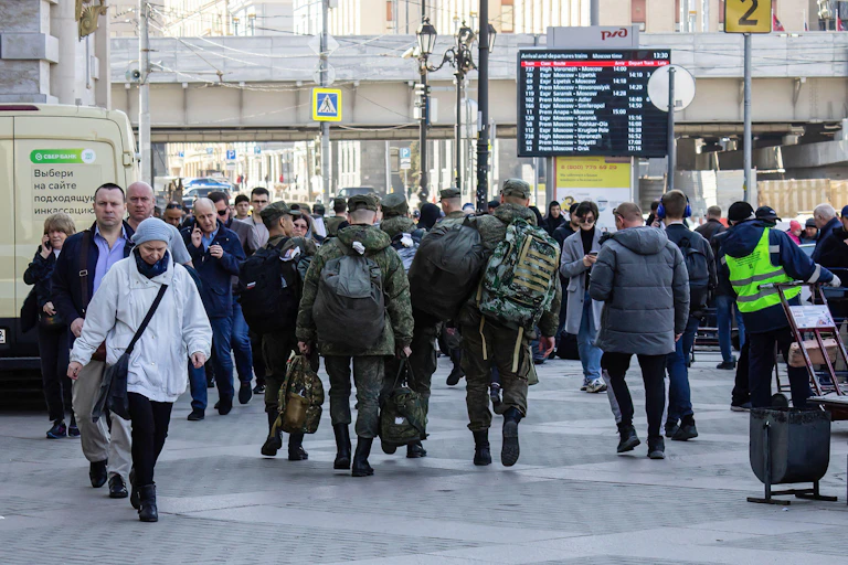 Newly conscripted Russian soldiers prepare to board a train in Moscow