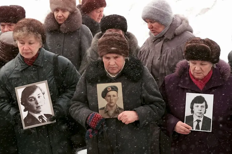 Mothers of Russian soldiers killed in Chechnya with pictures of their sons, February 2000/
