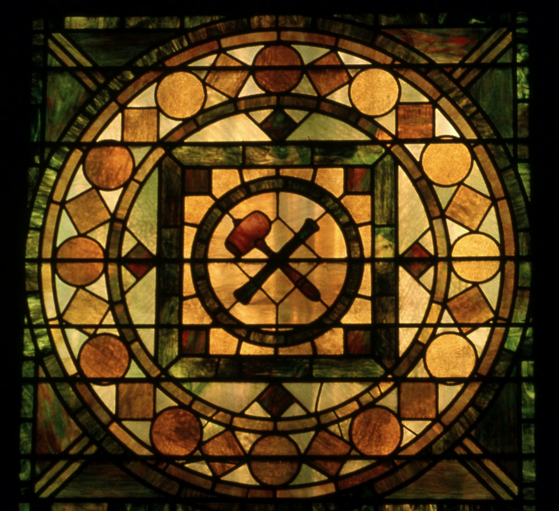 Stained glass window with squares, circles and other shapes