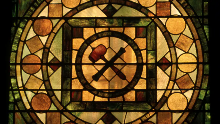 Stained glass window with squares, circles and other shapes
