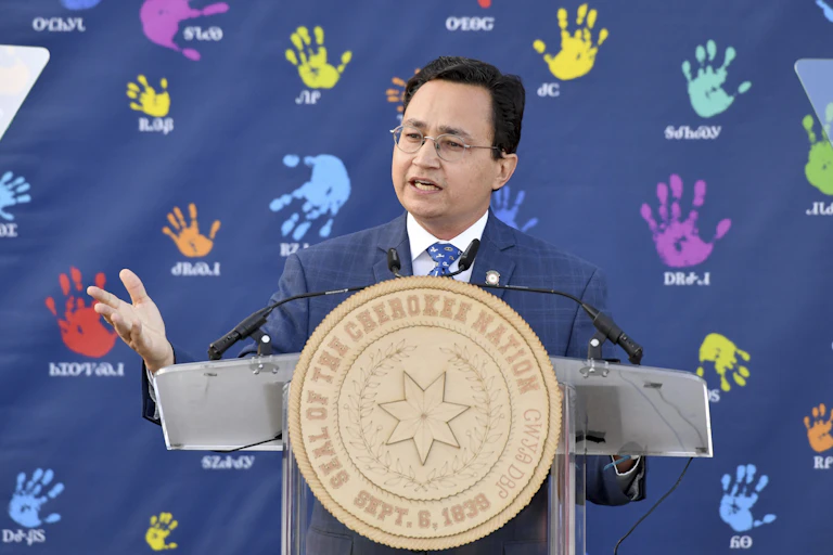 A man standing behind a podium delivering a speech.
