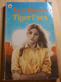 Book cover: a teen girl looking sad in the desert