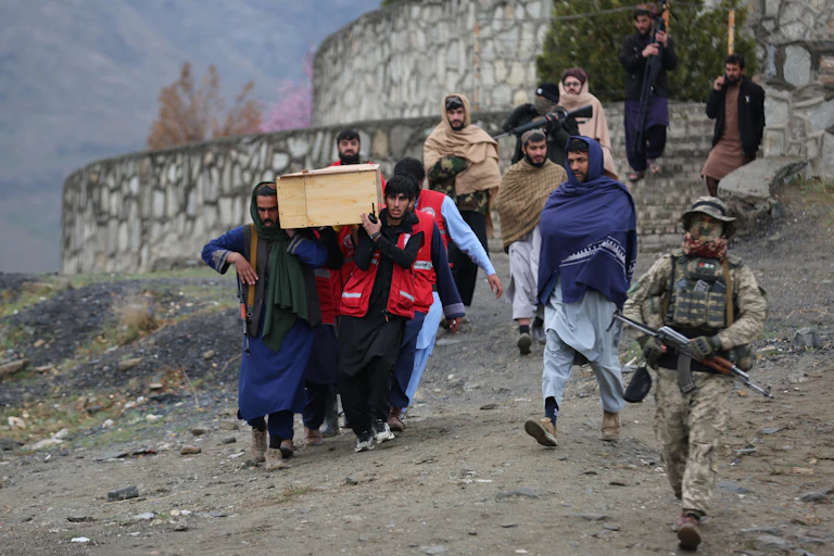 Men carry a wooden coffin.