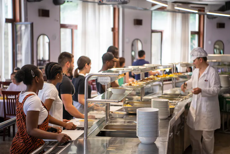 teens queuing at school canteen