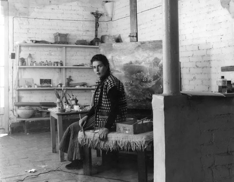 The Symptomatic Surreal: Leonora Carrington exhibition explores her advanced dating with dying 1 Leonora Carrington sitting in her studio in front of a large easel