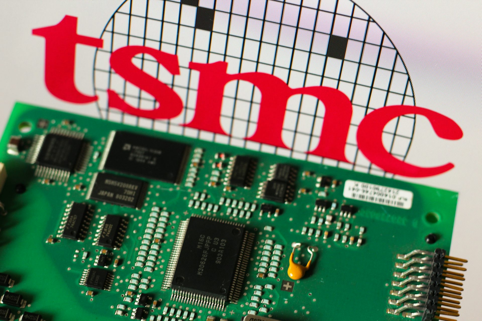 The TSMC logo displayed next to a smartphone chip.