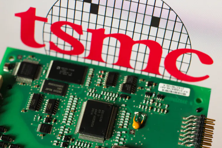 The TSMC logo displayed next to a smartphone chip.