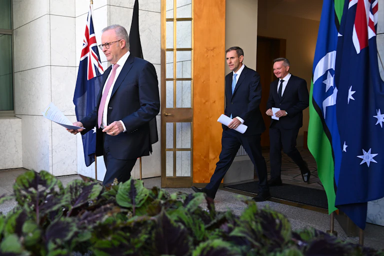 Prime Minister Anthony Albanese, Treasurer Jim Chalmers and Energy Minister Chris Bowen arrive at Monday's press conference.