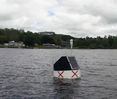 A research buoy, marked with two red X.