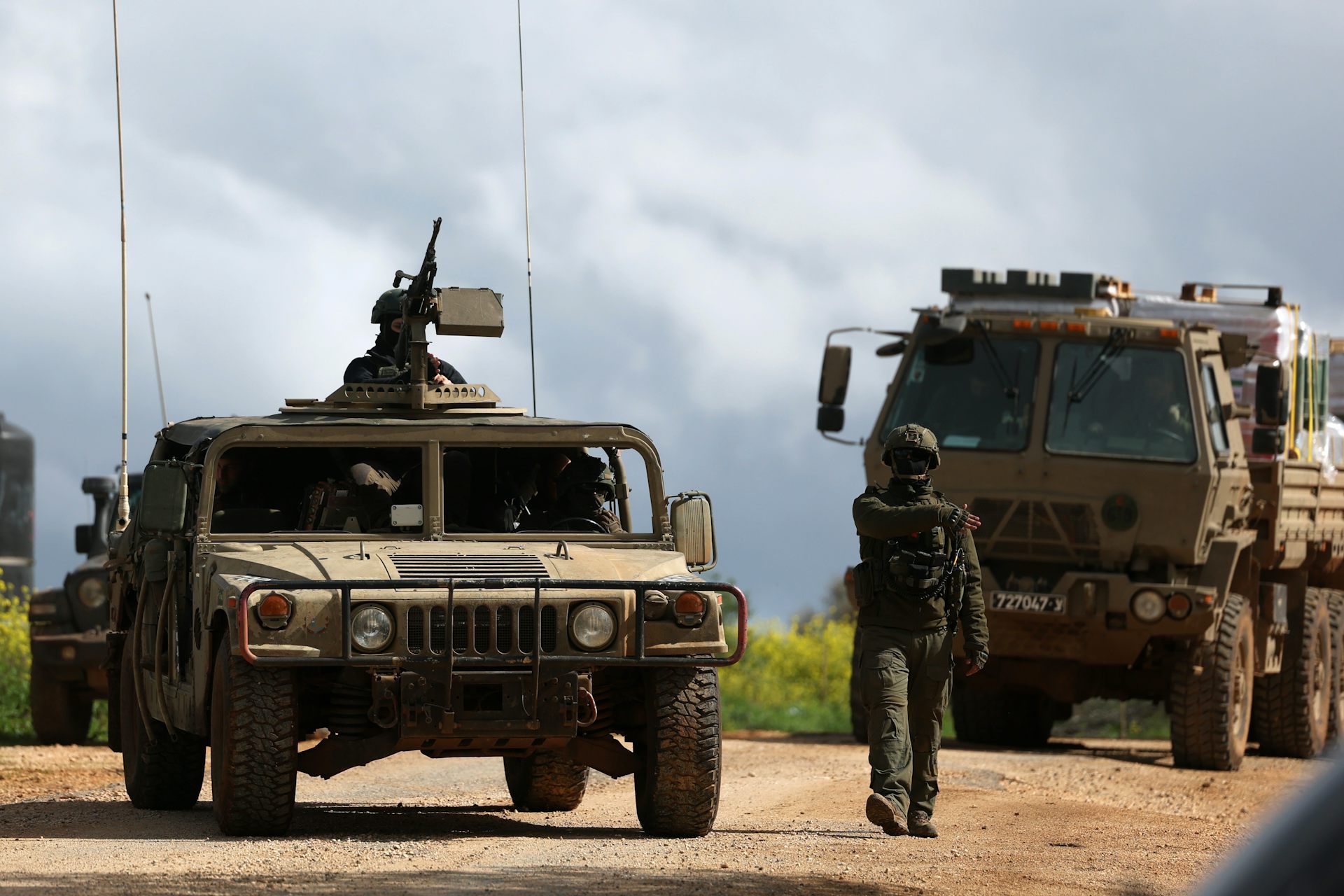 Israeli soldiers and military vehicles at an undisclosed position near the Israel-Lebanon border.