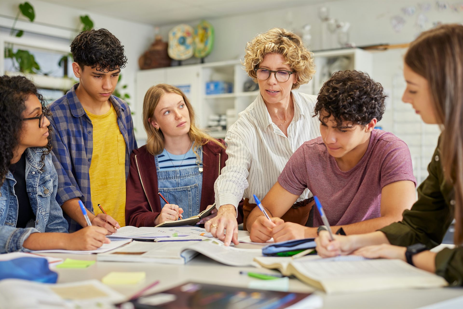 Teacher talking to teenagers