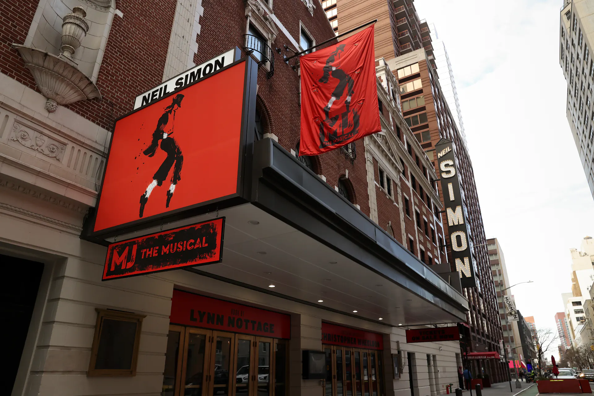 Banners for 'MJ The Musical' are seen hanging outside the Neil Simon Theatre in New York's Broadway district.