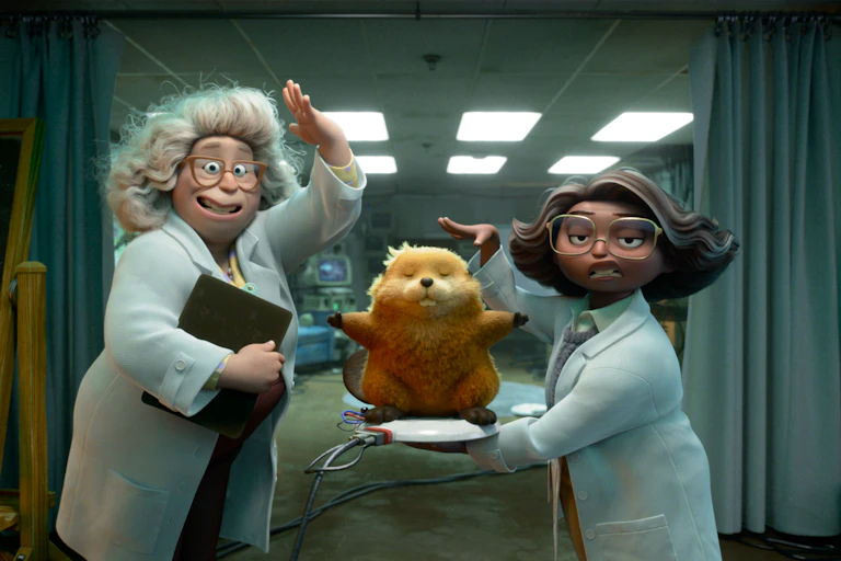 Film still: two women scientists and an animatronic beaver.