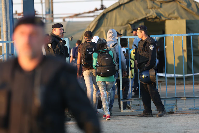 Refugees entering refugee camp
