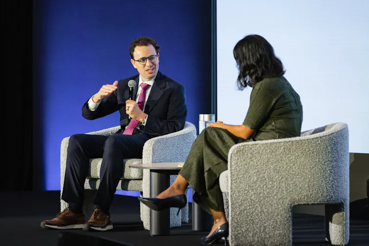 Anthropic chief executive Dario Amodei speaks to the Grattan Institute's Aruna Sathanapally at Parliament House.