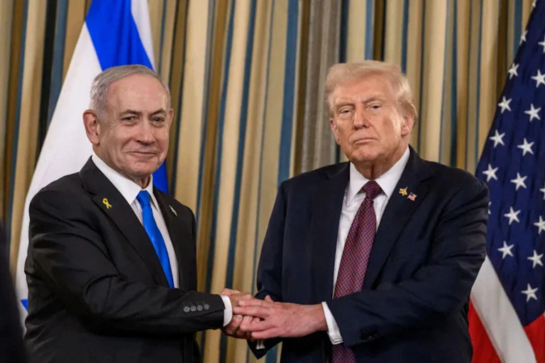 Israeli prime minister, Benjamin Netanyahu, clasps hands with US president, Donald Trump.