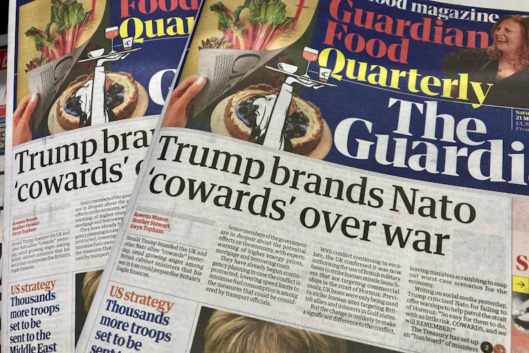 Headlines quoting Donald Trump calling Nato countries cowards,