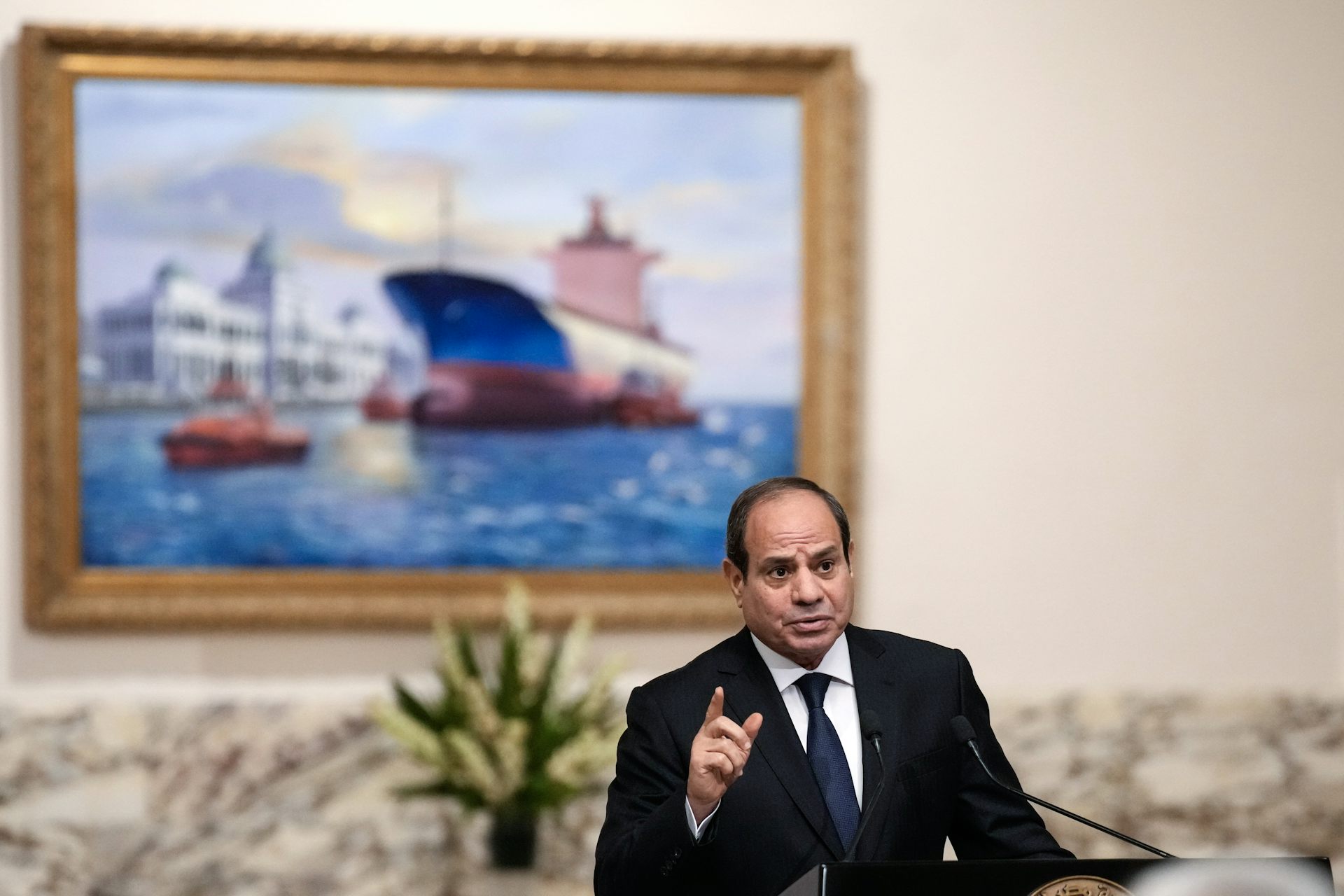 Abdel Fattah el-Sisi gestures during a press conference in Cairo.