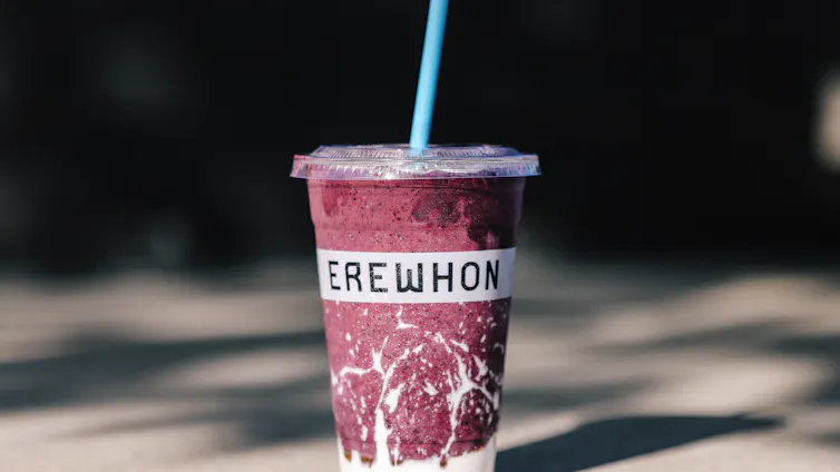 A photo of a chilled Erewhon smoothie that includes kefir, blueberries, honey, raw beef, bananas, sea salt and maple syrup.