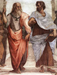 A faded painting shows two bearded men in robes, one of whom has gray hair, walking and gesturing side by side.