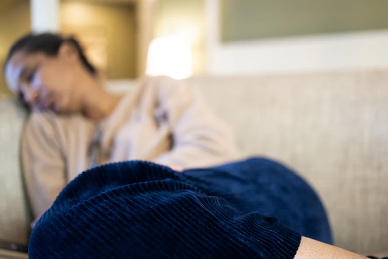 Women sleeping on a sofa